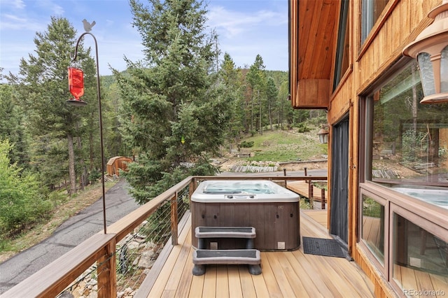 12191 Tecumseh Trl, Conifer, CO 80433 - wooden deck featuring a hot tub