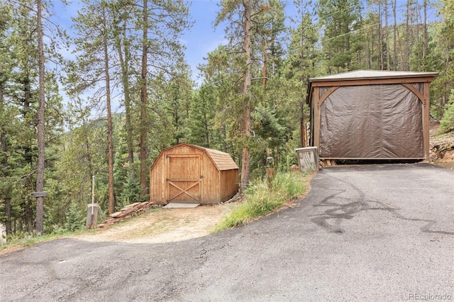 12191 Tecumseh Trl, Conifer, CO 80433 - view of shed with a view of trees