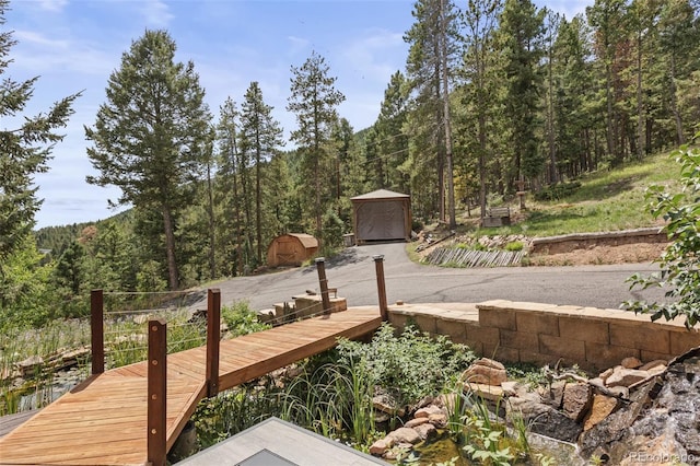 12191 Tecumseh Trl, Conifer, CO 80433 - deck with a wooded view