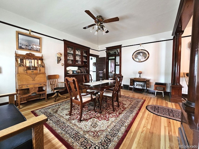 243 Park Ave, Salida, CO 81201 - dining room with ceiling fan, wood finished floors, and ornate columns