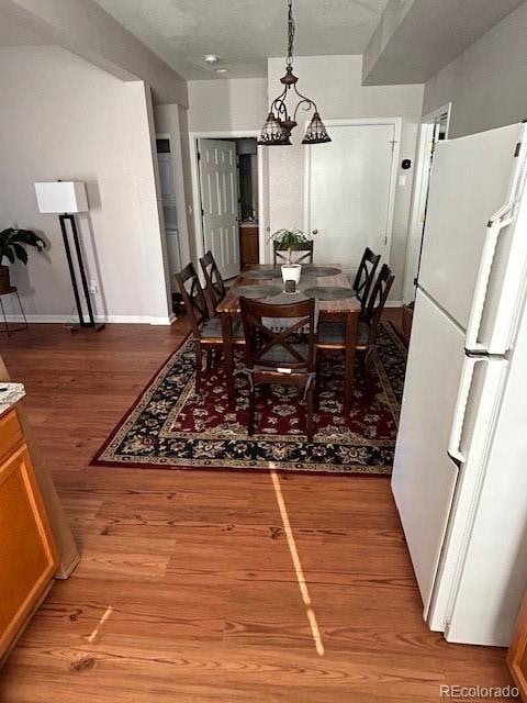 dining space featuring hardwood / wood-style floors