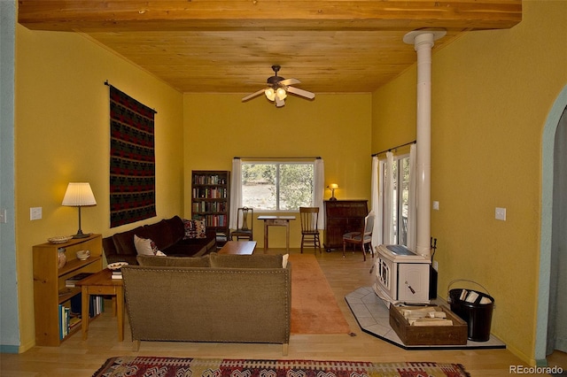 3713 Enchanted Way, Crestone, CO 81131 - living room with wooden ceiling, ceiling fan, a wood stove, and wood finished floors