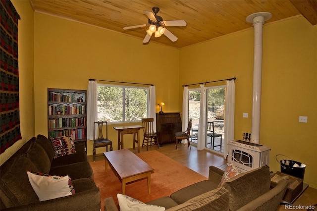 3713 Enchanted Way, Crestone, CO 81131 - living room with crown molding, ceiling fan, wooden ceiling, and a wood stove