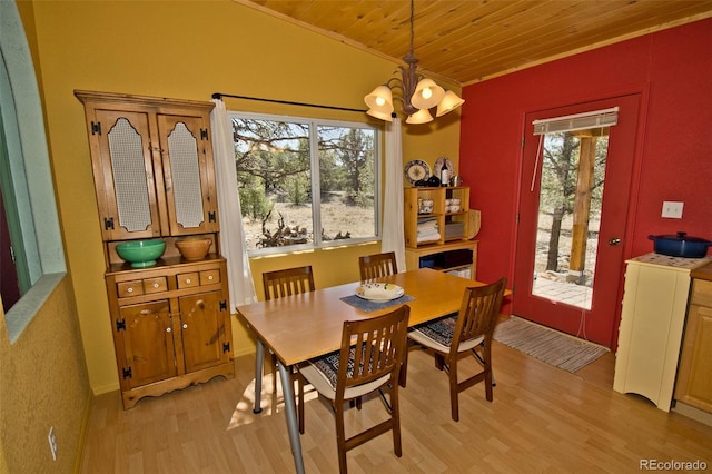 3713 Enchanted Way, Crestone, CO 81131 - dining area featuring ornamental molding, an inviting chandelier, wooden ceiling, and light wood-style flooring