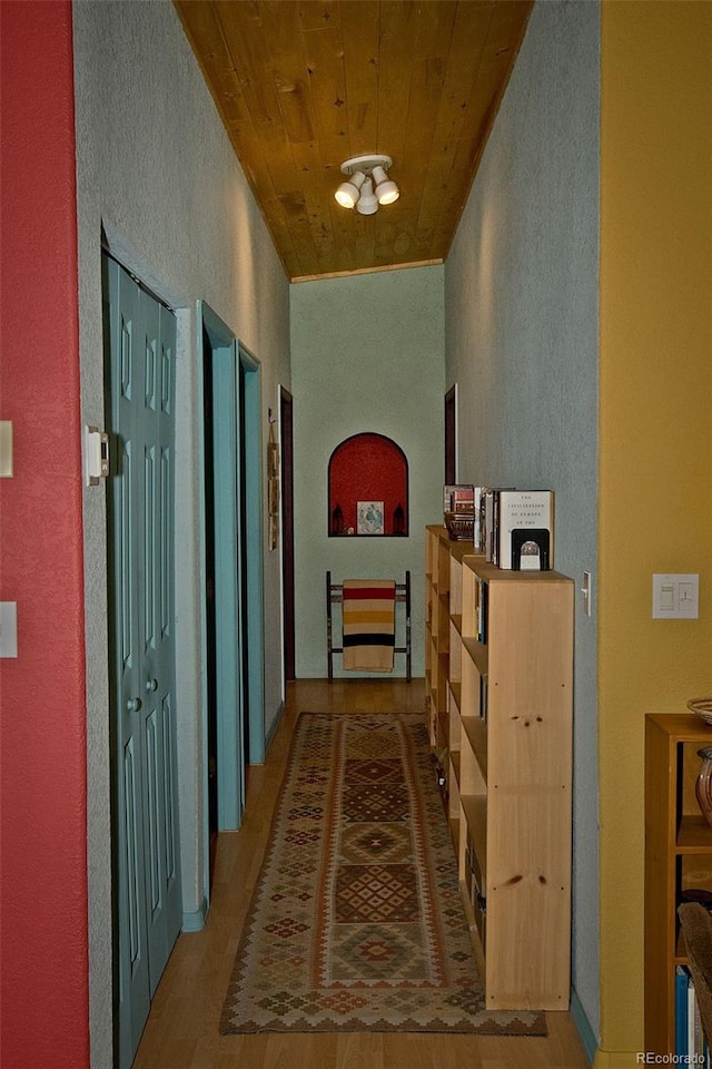 3713 Enchanted Way, Crestone, CO 81131 - corridor featuring wooden ceiling, a textured wall, and wood finished floors