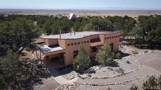 3713 Enchanted Way, Crestone, CO 81131 - aerial view featuring a wooded view