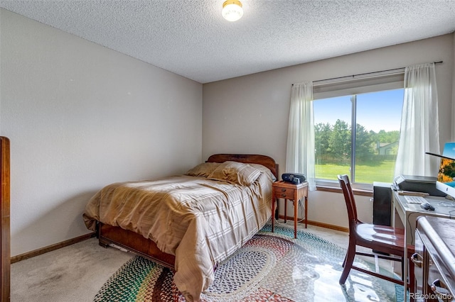 12565 Sheridan Blvd Unit 105, Broomfield, CO 80020 - bedroom with light colored carpet, baseboards, and a textured ceiling