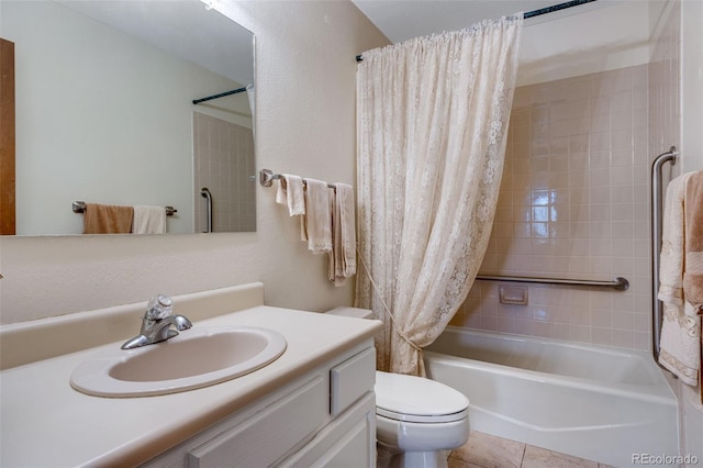 12565 Sheridan Blvd Unit 105, Broomfield, CO 80020 - full bathroom with vanity, toilet, shower / tub combo with curtain, and tile patterned floors