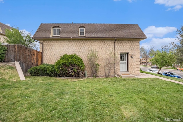 5573 S Lowell Blvd, Littleton, CO 80123 - view of property exterior featuring mansard roof, roof with shingles, and brick siding