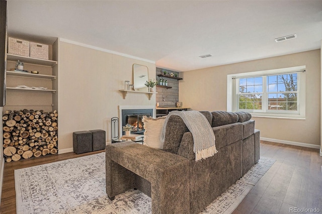 5573 S Lowell Blvd, Littleton, CO 80123 - living room featuring wood finished floors, a glass covered fireplace, and baseboards