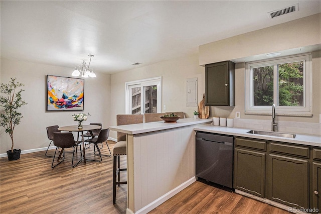 5573 S Lowell Blvd, Littleton, CO 80123 - kitchen with dishwasher, a sink, a peninsula, and light wood-type flooring