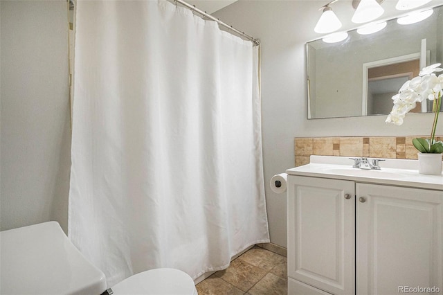 5573 S Lowell Blvd, Littleton, CO 80123 - full bathroom with toilet, vanity, and curtained shower