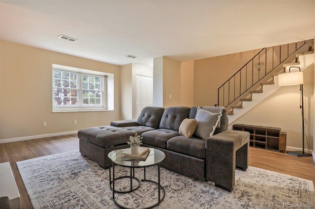 5573 S Lowell Blvd, Littleton, CO 80123 - living room with wood finished floors, baseboards, and stairs