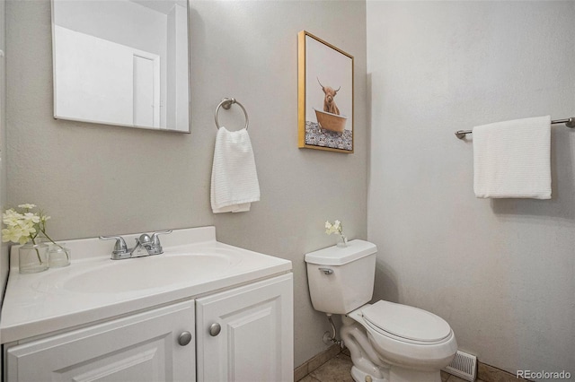 5573 S Lowell Blvd, Littleton, CO 80123 - half bath featuring toilet, vanity, tile patterned flooring, and baseboards