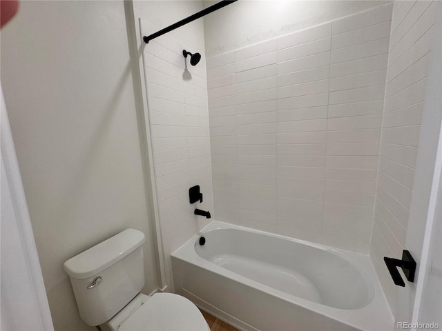 bathroom with shower / washtub combination and toilet