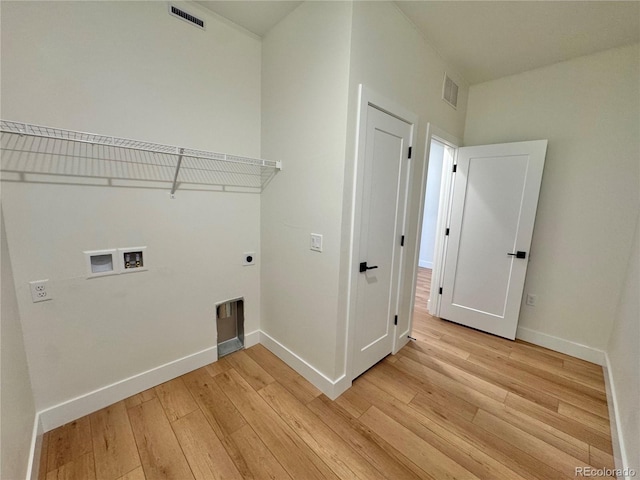 laundry room with light wood-style floors, hookup for a washing machine, visible vents, and electric dryer hookup