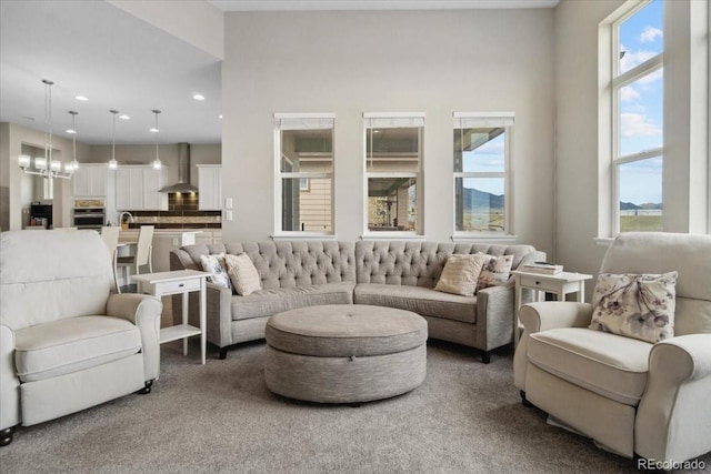 19409 W 88th Dr, Arvada, CO 80007 - living area with recessed lighting, a chandelier, and carpet floors
