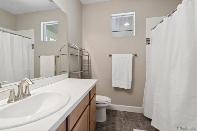 19409 W 88th Dr, Arvada, CO 80007 - full bath featuring baseboards, vanity, toilet, tile patterned floors, and curtained shower