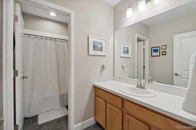 19409 W 88th Dr, Arvada, CO 80007 - full bath with vanity, baseboards, and a shower with curtain