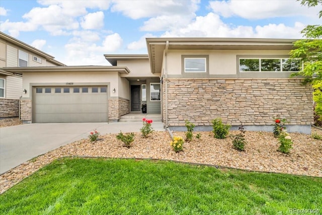 19409 W 88th Dr, Arvada, CO 80007 - prairie-style house featuring stucco siding, a garage, driveway, and stone siding