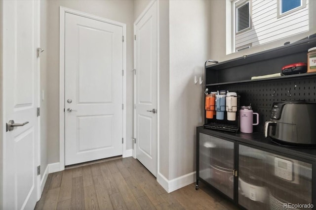 19409 W 88th Dr, Arvada, CO 80007 - corridor featuring baseboards and wood finished floors