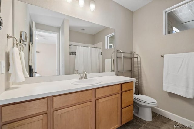 19409 W 88th Dr, Arvada, CO 80007 - full bathroom featuring toilet, vanity, tile patterned floors, baseboards, and a shower with shower curtain