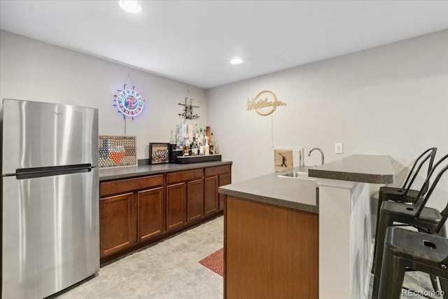 19409 W 88th Dr, Arvada, CO 80007 - bar with freestanding refrigerator, a sink, and recessed lighting