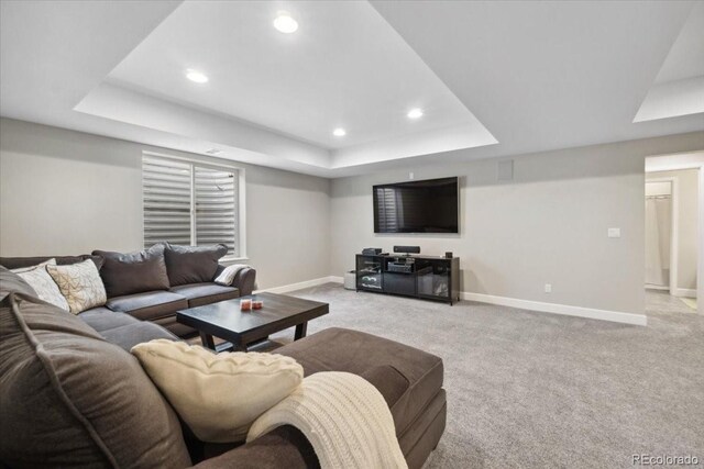19409 W 88th Dr, Arvada, CO 80007 - living area featuring a tray ceiling, baseboards, light carpet, and recessed lighting