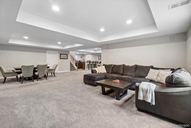 19409 W 88th Dr, Arvada, CO 80007 - carpeted living room with a tray ceiling, stairway, recessed lighting, and baseboards