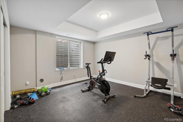 19409 W 88th Dr, Arvada, CO 80007 - exercise area featuring a tray ceiling and baseboards
