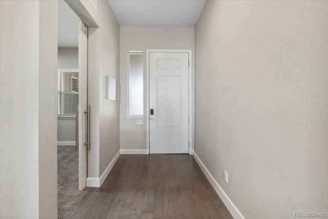 19409 W 88th Dr, Arvada, CO 80007 - corridor featuring baseboards and hardwood / wood-style flooring
