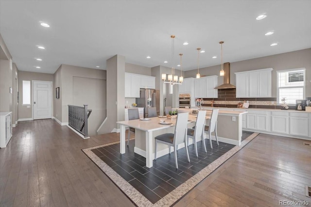 19409 W 88th Dr, Arvada, CO 80007 - dining space featuring wood-type flooring, recessed lighting, and a chandelier