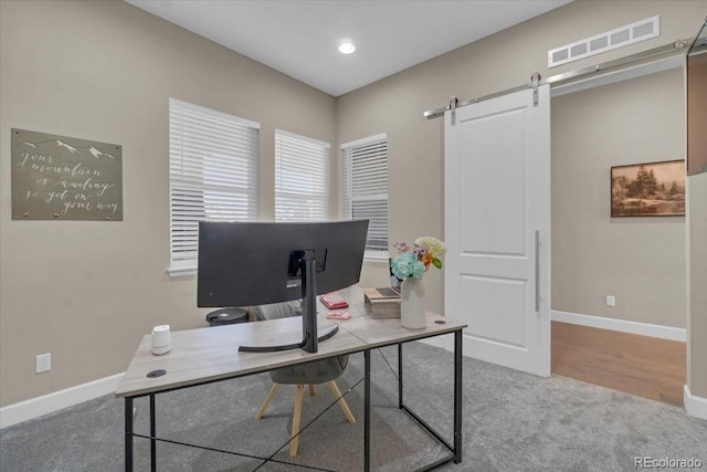 19409 W 88th Dr, Arvada, CO 80007 - carpeted home office featuring a barn door and recessed lighting
