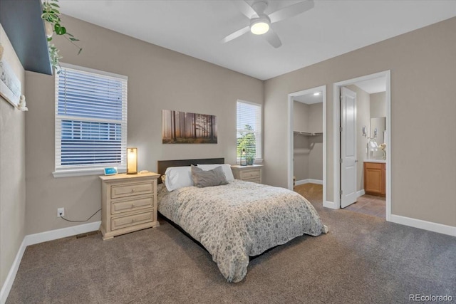 19409 W 88th Dr, Arvada, CO 80007 - carpeted bedroom with a spacious closet, ensuite bathroom, and ceiling fan