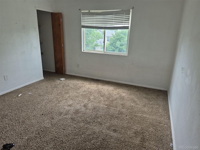 1415 S Pitkin Ct, Aurora, CO 80017 - carpeted empty room featuring baseboards