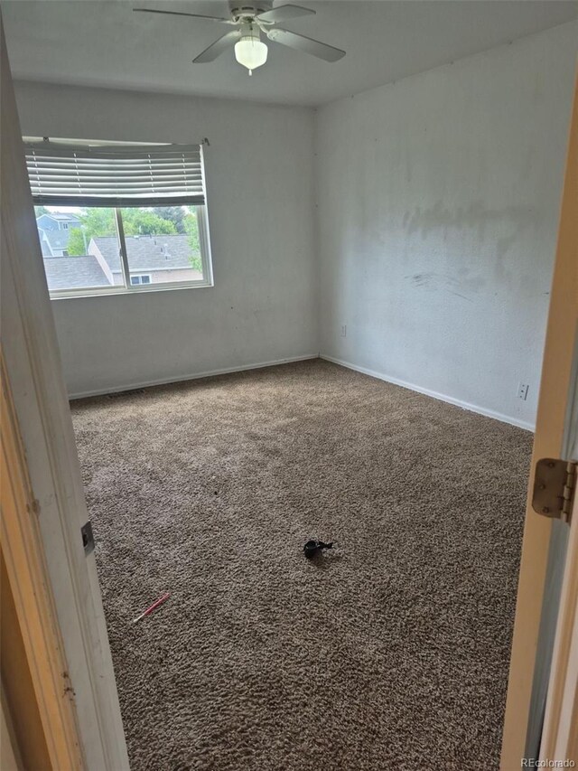 1415 S Pitkin Ct, Aurora, CO 80017 - spare room featuring a ceiling fan and baseboards