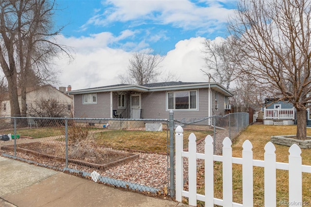 view of front facade with a fenced front yard and a front yard