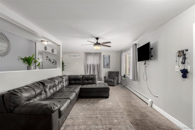 117 6th St, Frederick, CO 80530 - carpeted living room featuring a baseboard radiator, ceiling fan, and baseboards