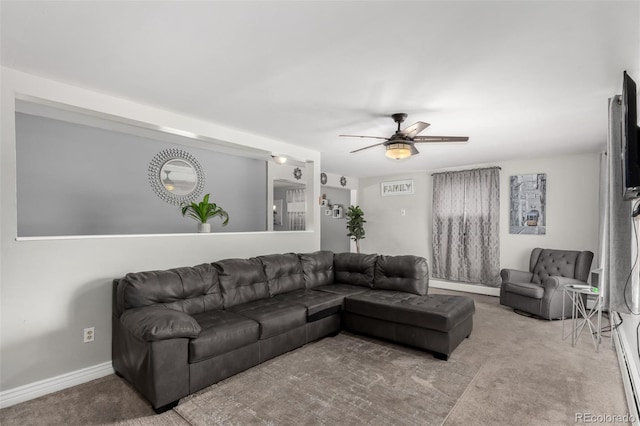 117 6th St, Frederick, CO 80530 - carpeted living area featuring ceiling fan, a baseboard heating unit, and baseboards