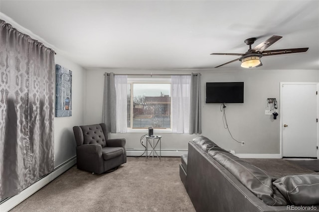 117 6th St, Frederick, CO 80530 - living room with baseboard heating, carpet flooring, ceiling fan, and baseboards