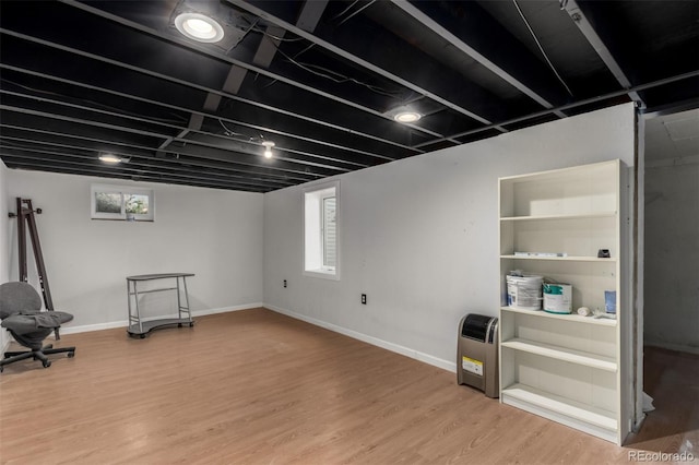 117 6th St, Frederick, CO 80530 - below grade area with light wood-style flooring and baseboards