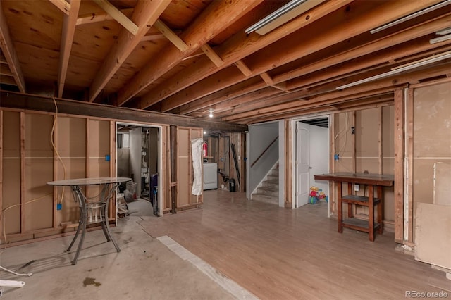 117 6th St, Frederick, CO 80530 - unfinished below grade area featuring washer / dryer and stairs