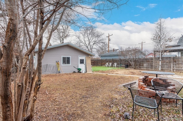 117 6th St, Frederick, CO 80530 - fenced backyard with an outdoor fire pit