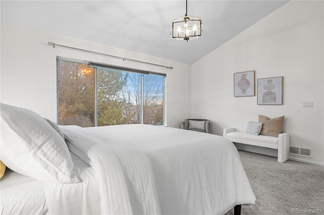 carpeted bedroom with vaulted ceiling and a chandelier
