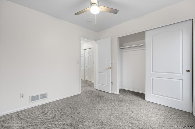 unfurnished bedroom with carpet flooring, baseboards, a closet, and ceiling fan