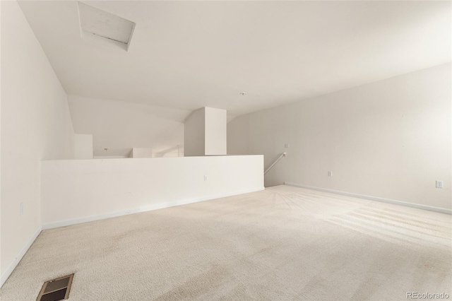 unfurnished room featuring light colored carpet