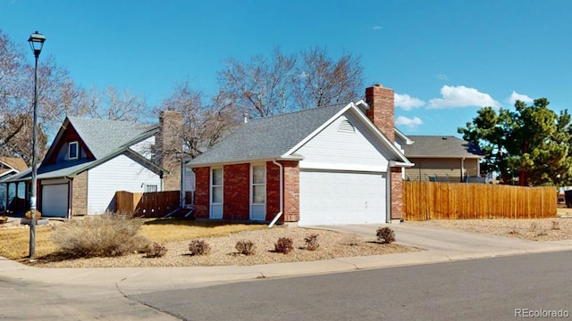 single story home with a garage, brick siding, fence, driveway, and a chimney