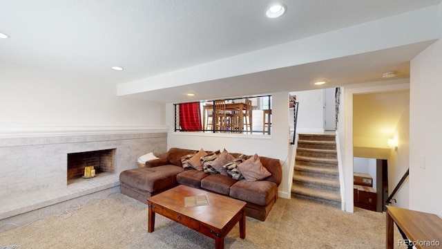 living room featuring carpet floors, stairway, a fireplace, and recessed lighting