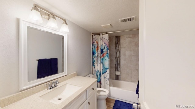 bathroom featuring visible vents, toilet, shower / bath combo with shower curtain, a textured ceiling, and vanity