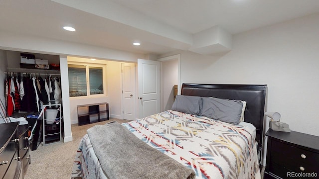 bedroom with baseboards, a closet, carpet, and recessed lighting